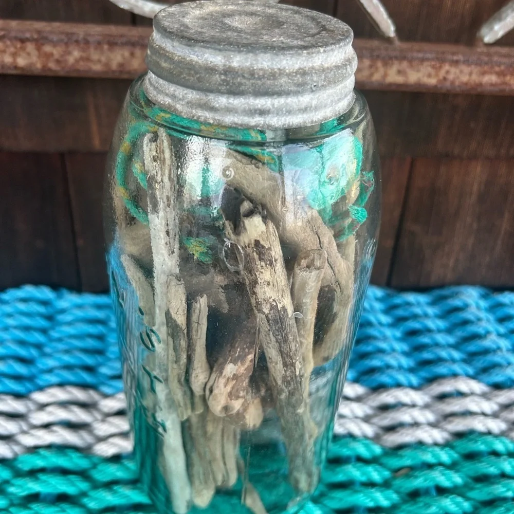 Vintage glass jar with zinc top filled with driftwood and sea rope from Montauk